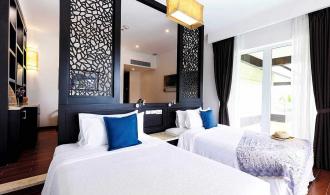 Nam Hoi An Superior Junior Suite Garden View Schlafzimmer